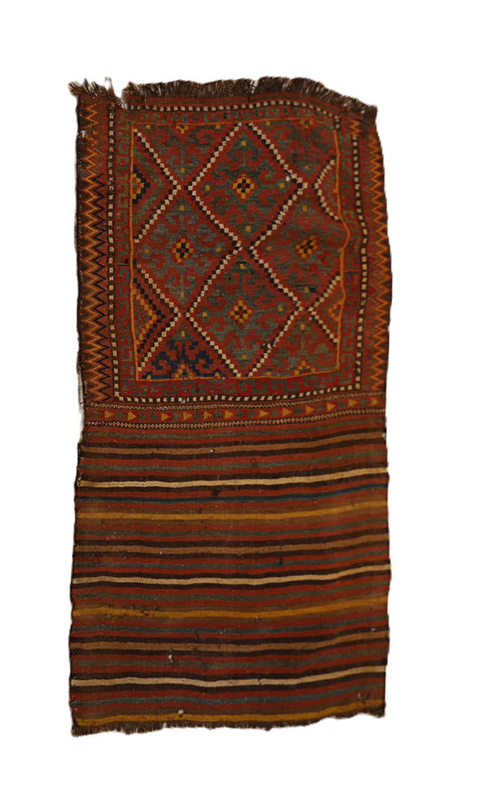 Traditional patterned rug with a geometric design on a white background