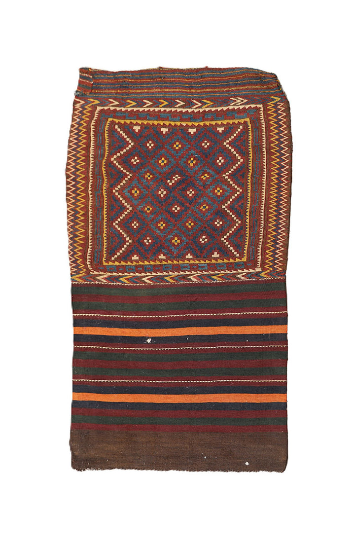 Traditional patterned rug with geometric design on a white background