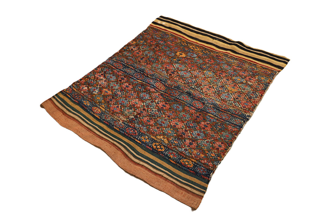 Decorative rug with intricate patterns on a white background