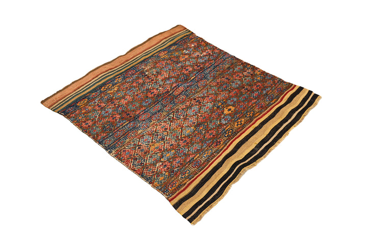 Decorative rug with intricate patterns on a white background