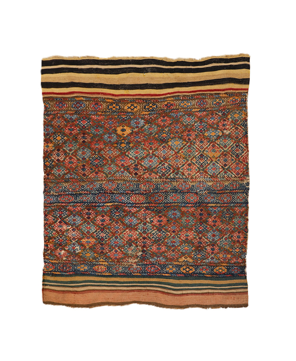 Traditional patterned rug with multicolor design on a white background