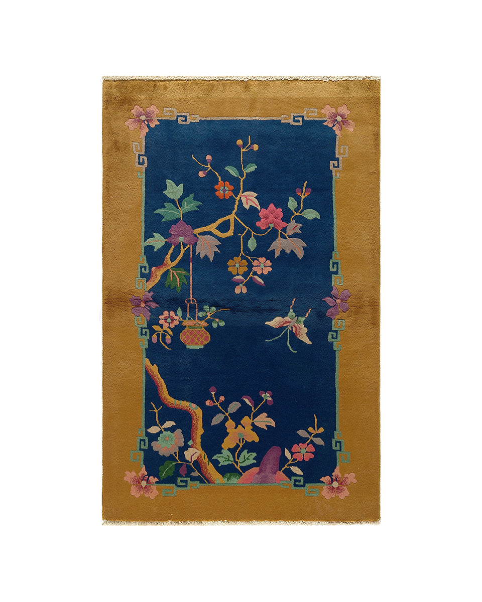 Decorative rug with floral design on a blue background