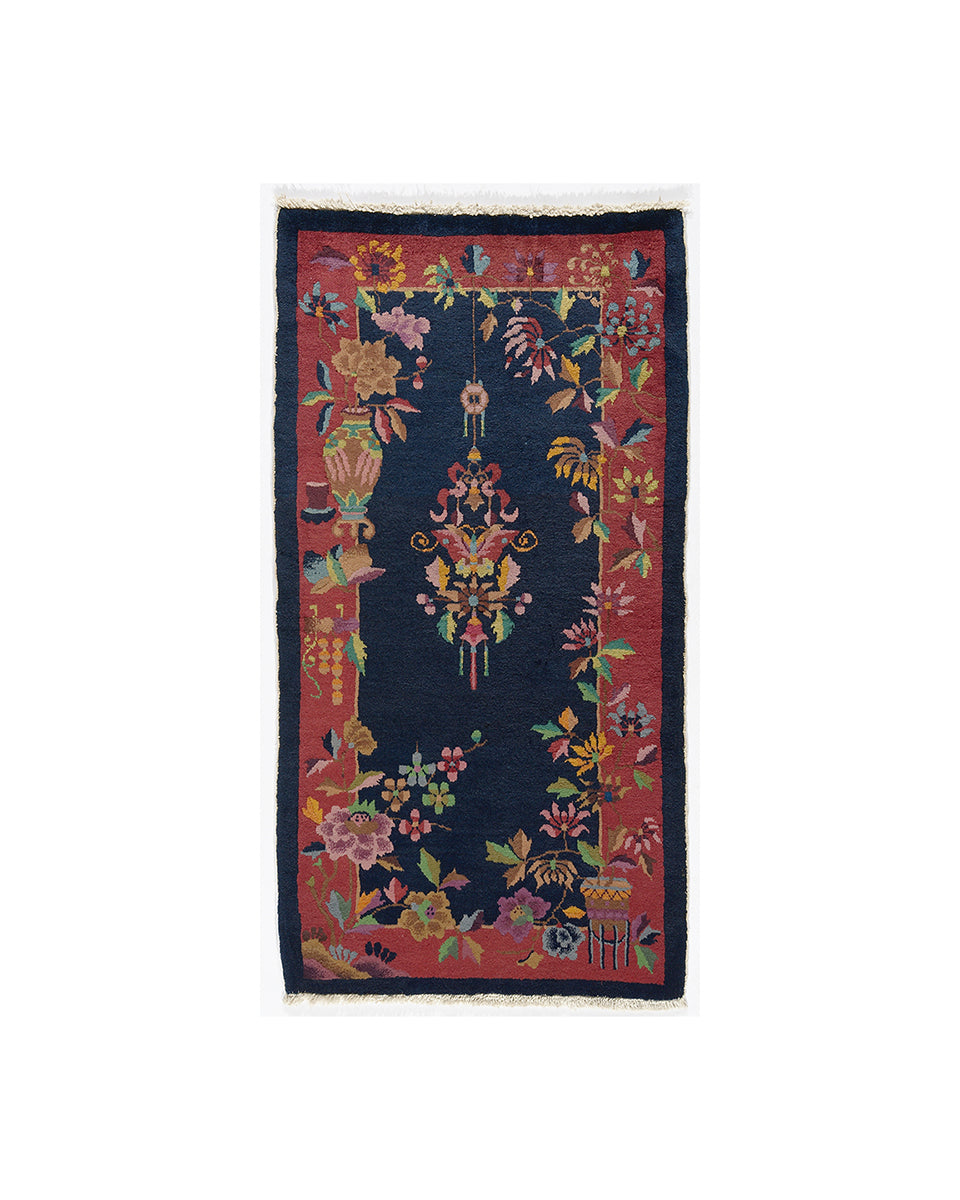 Decorative rug with floral and bird patterns on a white background