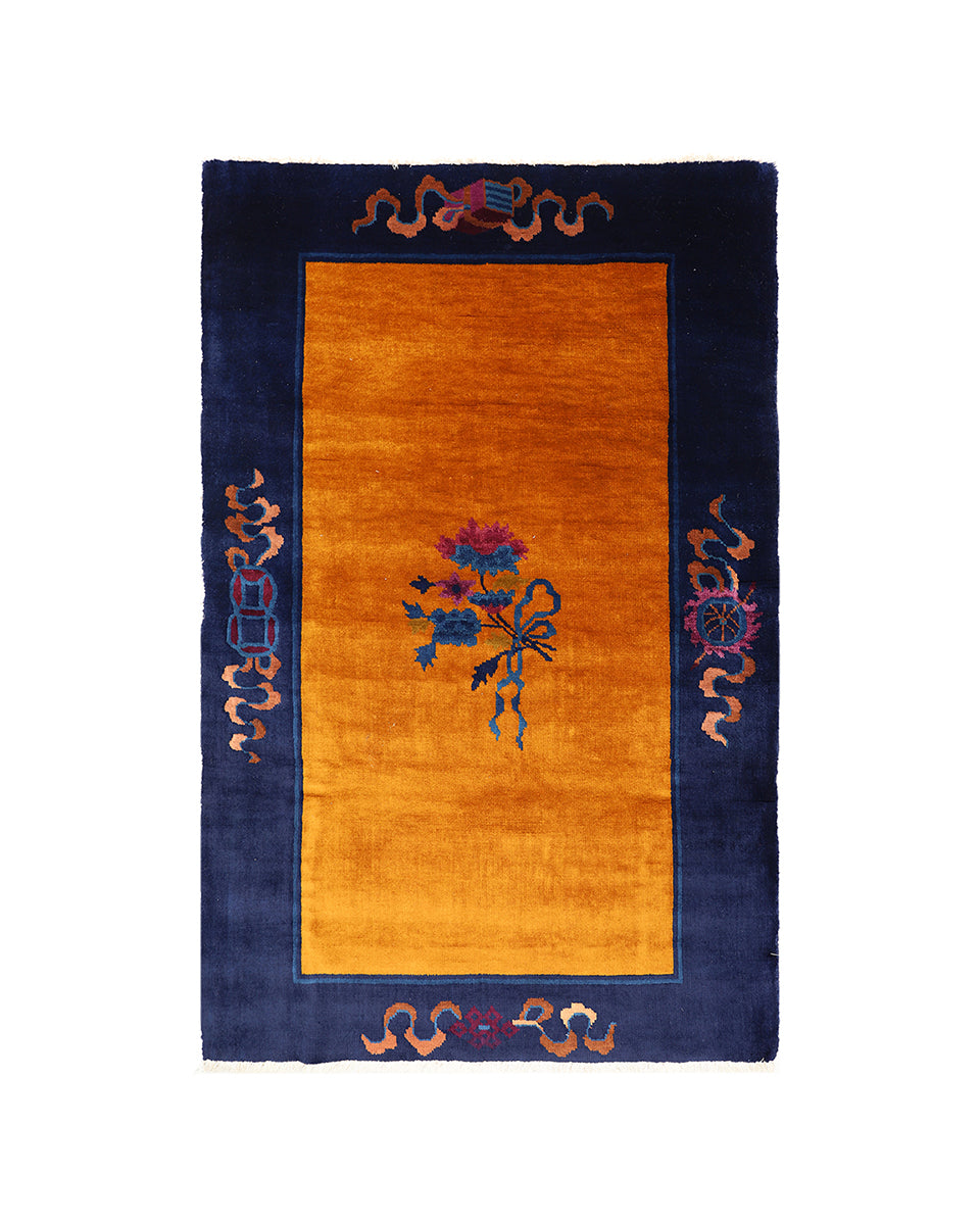 Decorative rug with floral design and border on a white background