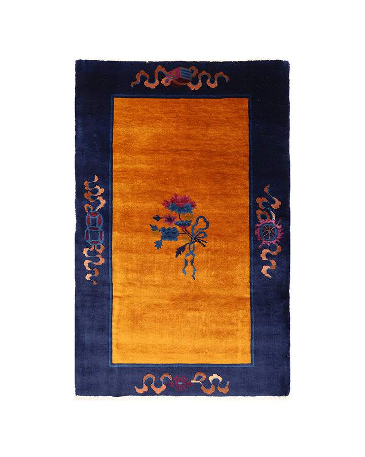 Decorative rug with floral design and border on a white background