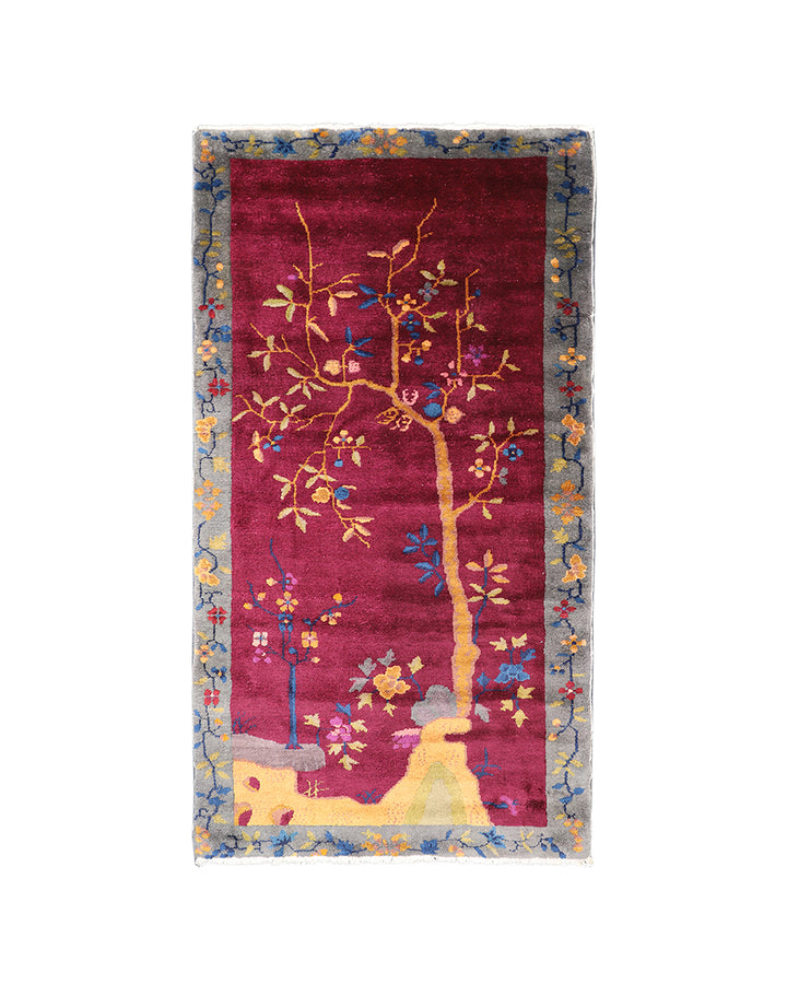 Decorative rug with tree design on a white background