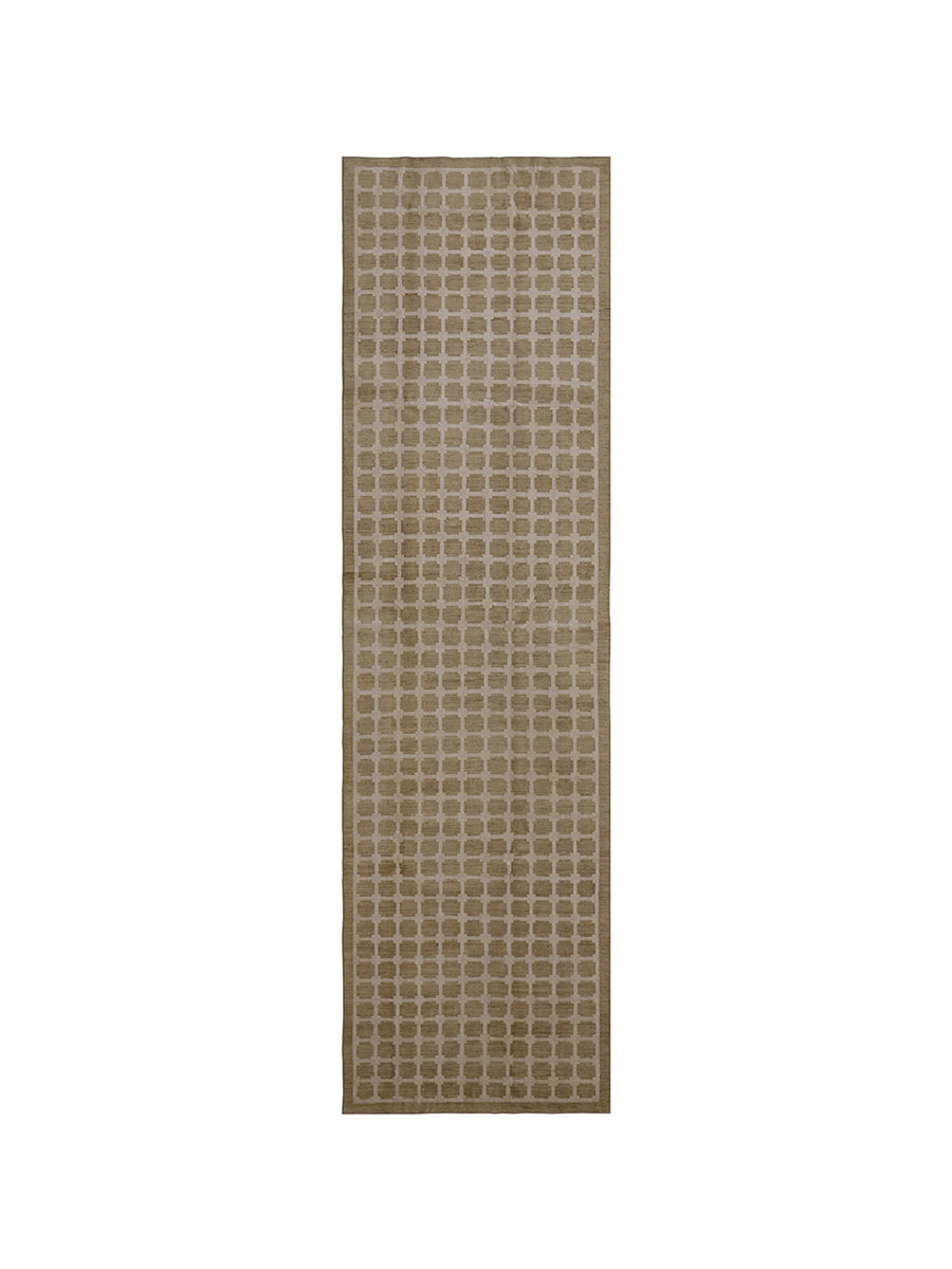 Rectangular beige rug with a subtle pattern on a white background