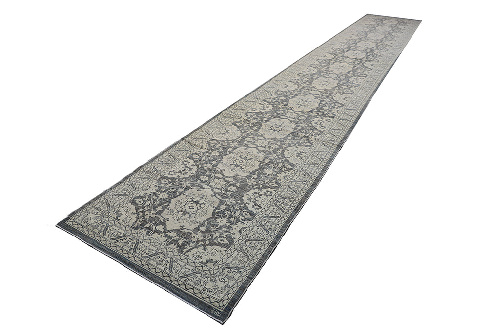 Long rectangular rug with floral pattern on a white background