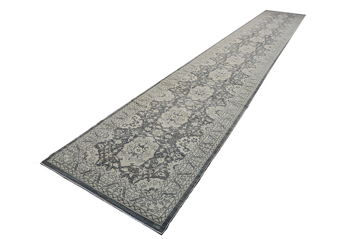 Long rectangular rug with floral pattern on a white background