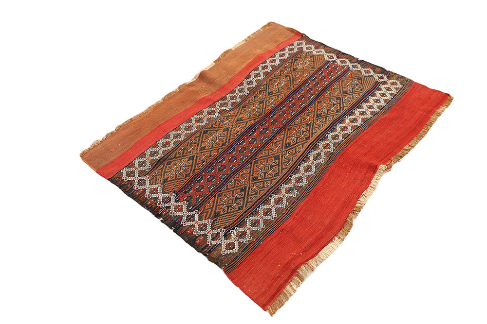 Traditional woven textile with intricate patterns on a white background