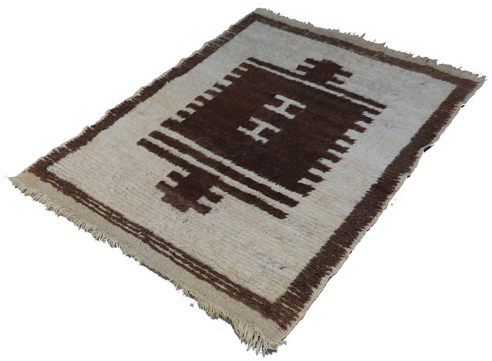 Woven rug with geometric pattern on a plain background
