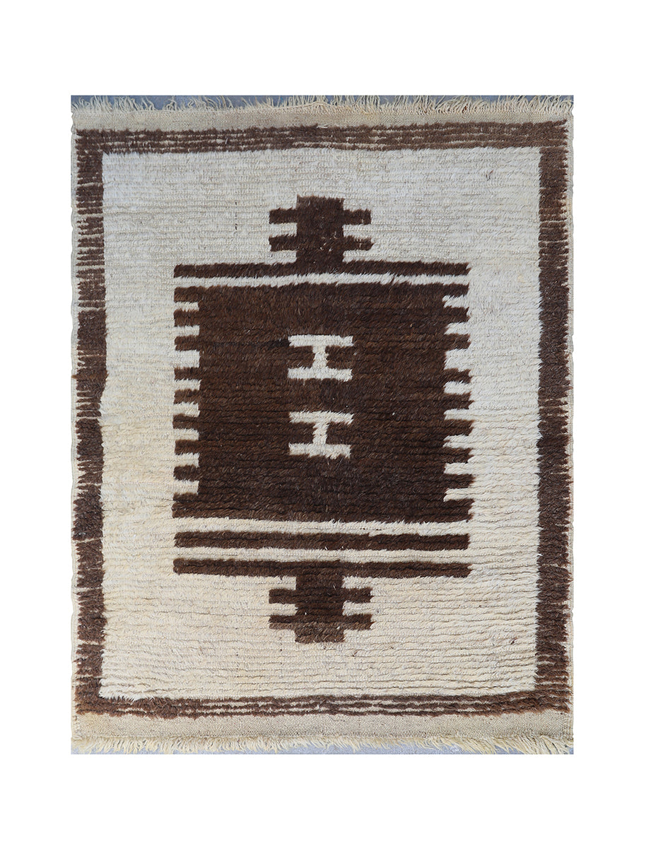 Small rug with geometric pattern on a white background