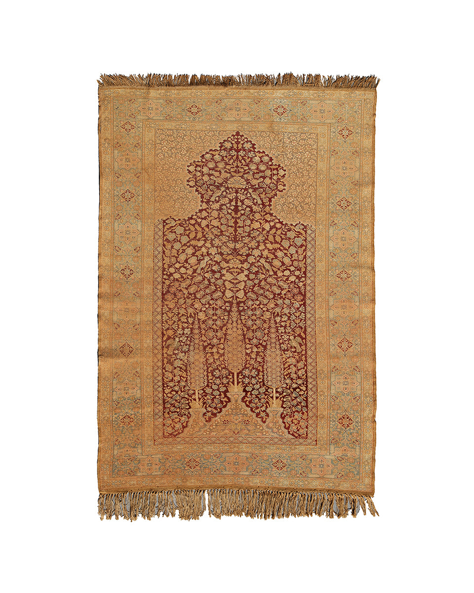 Decorative rug with intricate design on a beige background