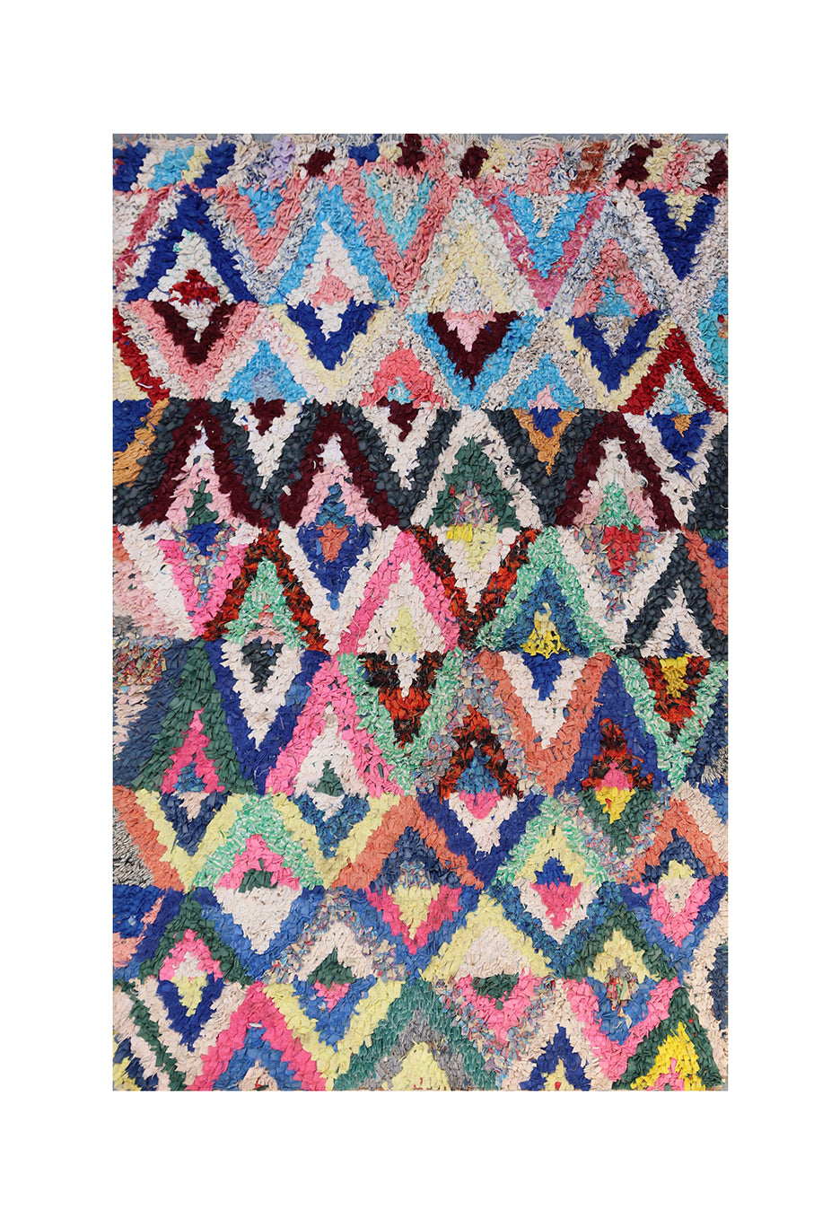 Multicolored geometric patterned rug on a white background