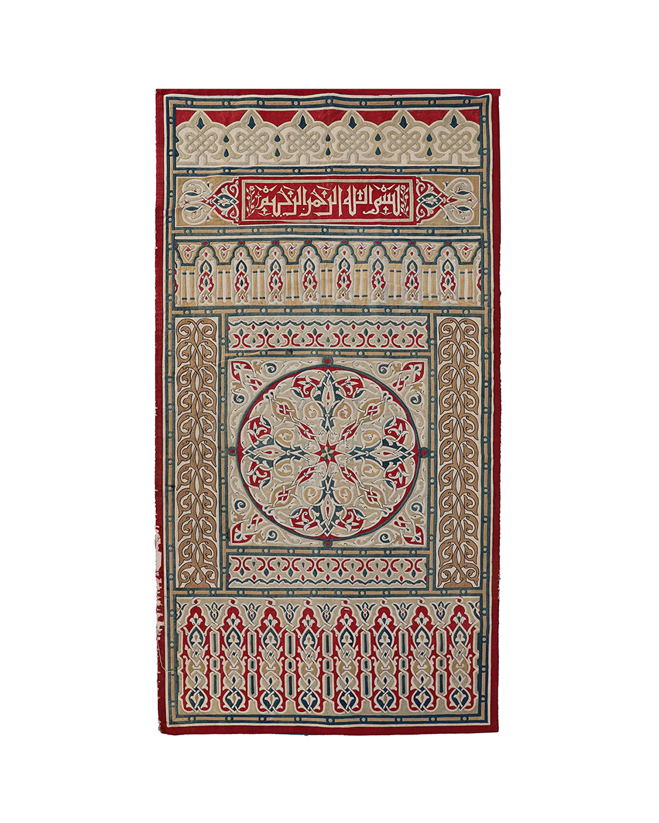 Decorative prayer rug with intricate patterns and text on a white background