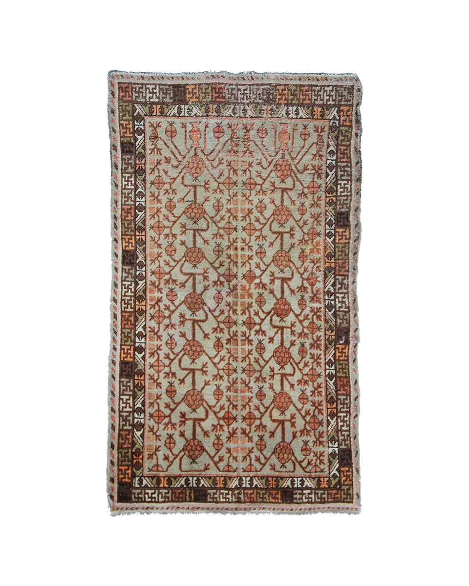 Decorative rug with intricate patterns on a white background