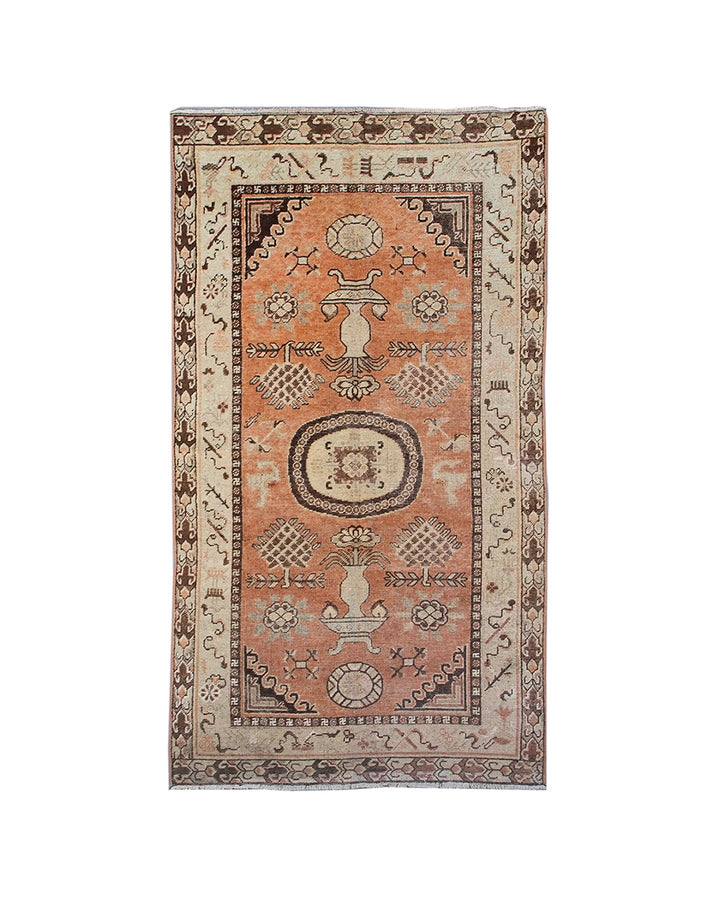 Decorative rug with intricate patterns on a white background