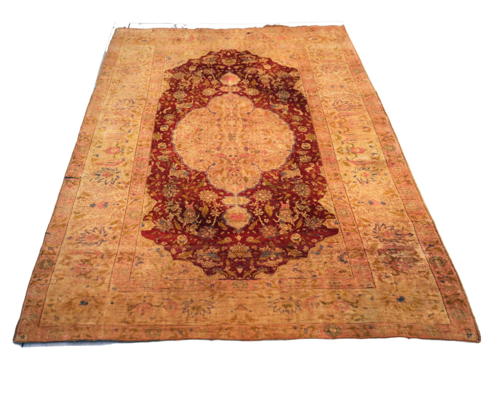 Vintage rug with intricate design on a white background