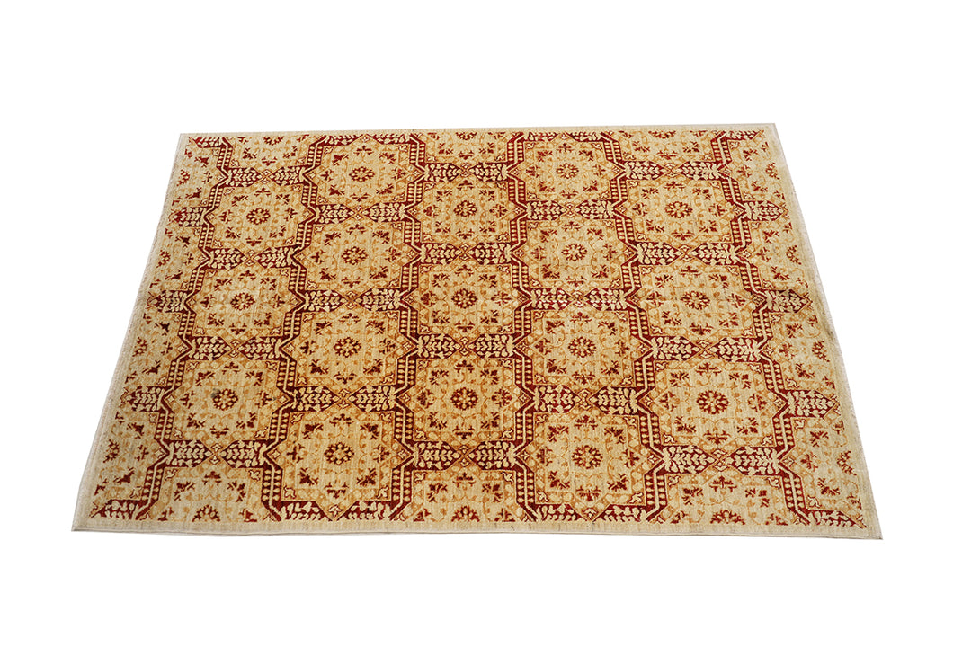 Beige rug with red geometric pattern on a white background