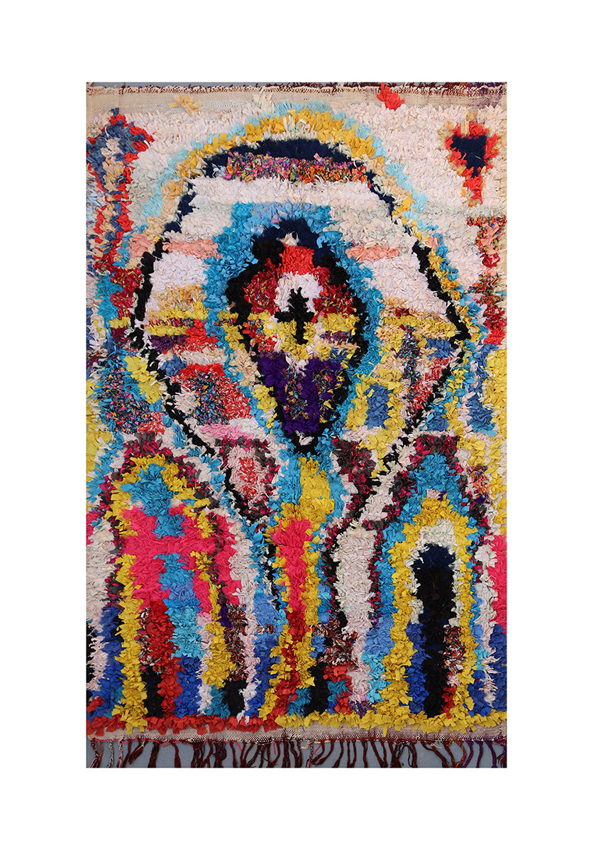 Multicolored abstract patterned rug on a white background