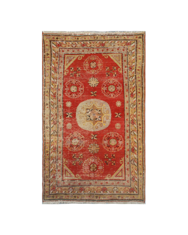 Authentic antique hand-knotted Samarkand Khotan wool area rug featuring central medallions in gold and neutral tones on an orange-red field