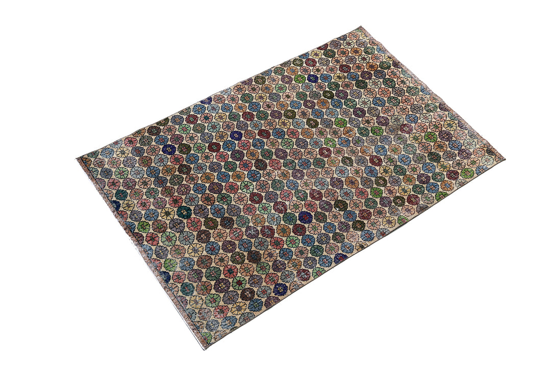 Multicolored patterned rug on a white background