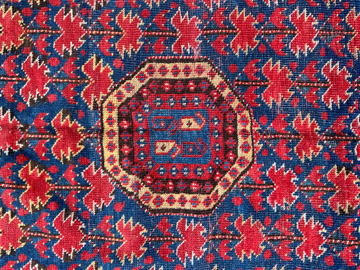 Close-up of a patterned fabric with red and blue colors