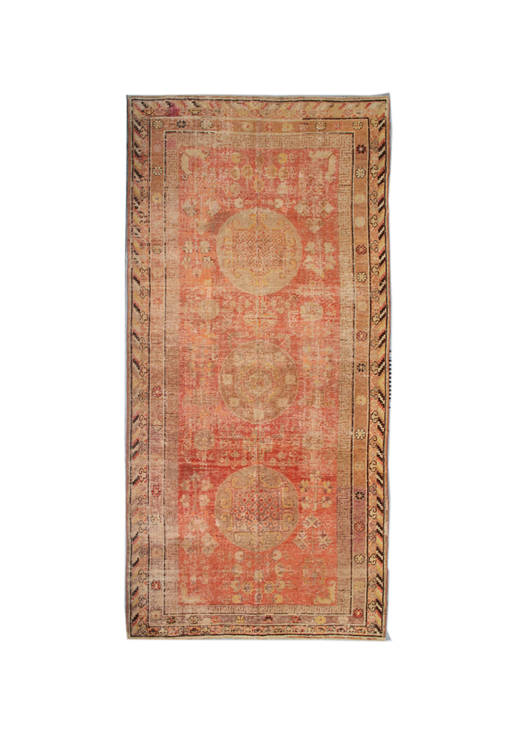 A rectangular vintage-style area rug with a distressed terracotta red center, three large circular medallions, and a detailed beige and brown border, shown flat against a white background.