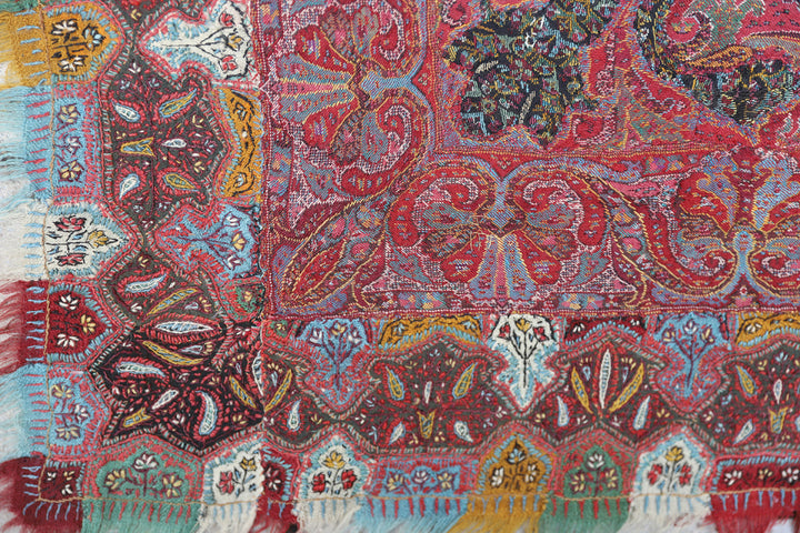 Close-up of a colorful patterned fabric with intricate designs.