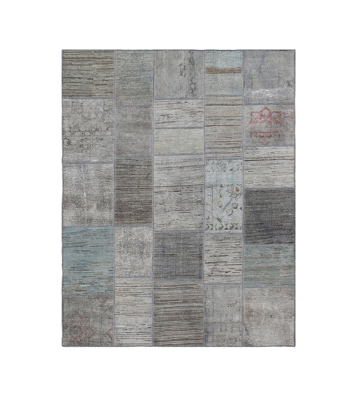 Patchwork rug with gray and blue tones on a white background