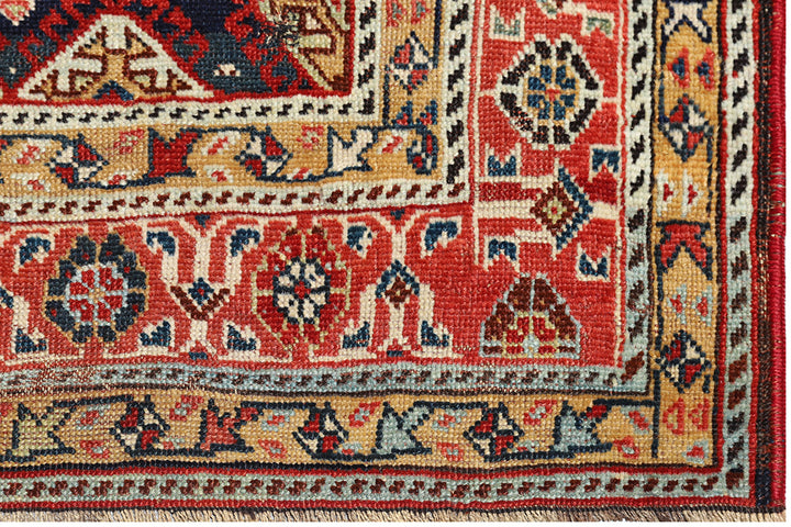 Unique 6x9 antique distressed Persian Qashqai tribal rug with navy background from a trusted dealer with over 45 years of experience.