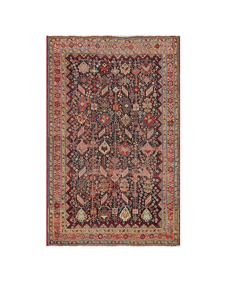 Unique 6x9 antique distressed Persian Qashqai tribal rug with navy background from a trusted dealer with over 45 years of experience.