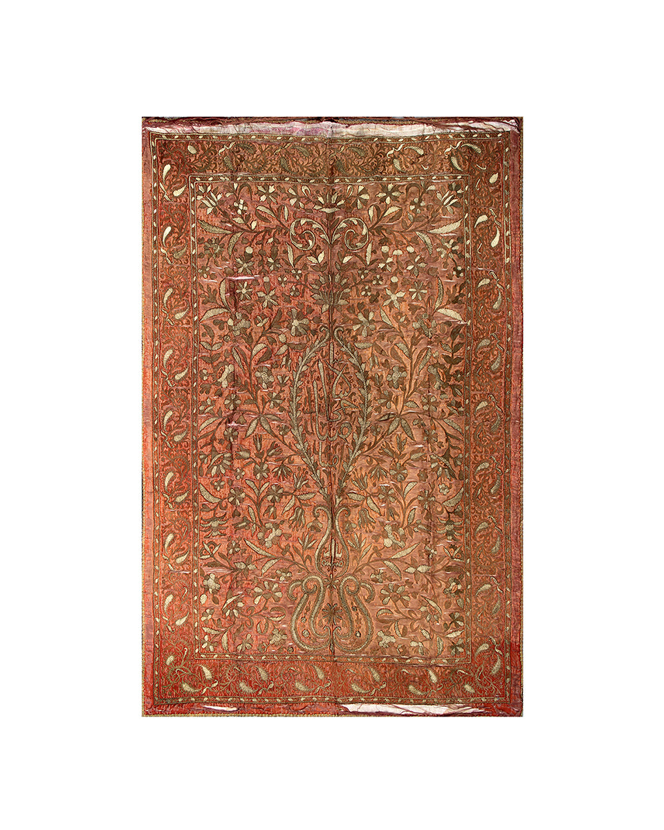 Decorative metal panel with intricate floral patterns on a white background