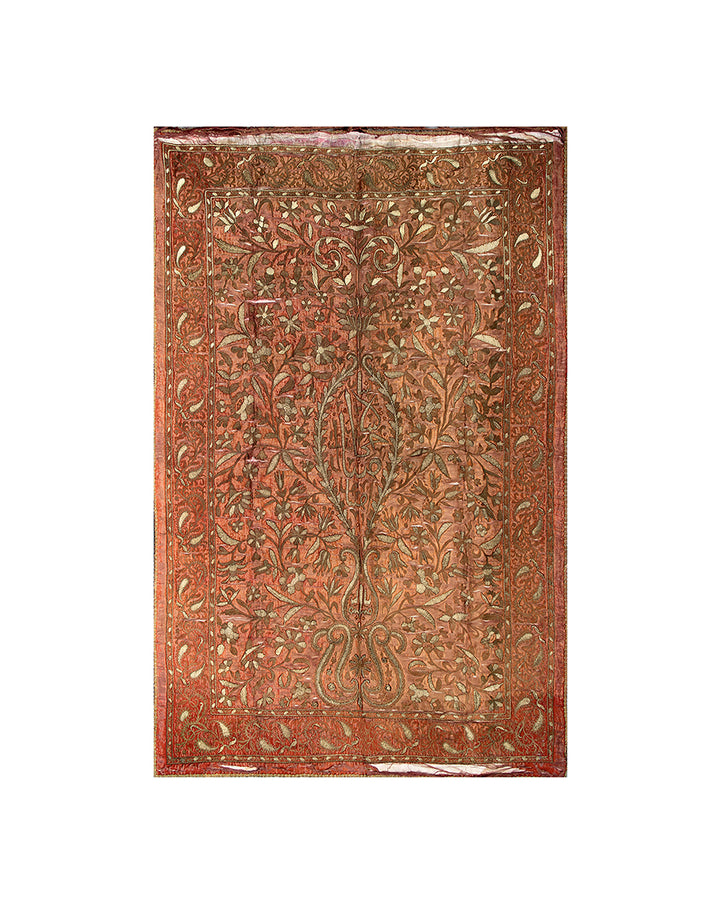 Decorative metal panel with intricate floral patterns on a white background