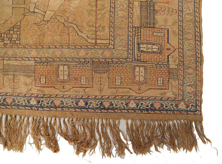 Close-up of an intricately designed rug with visible patterns and fringes on a white background