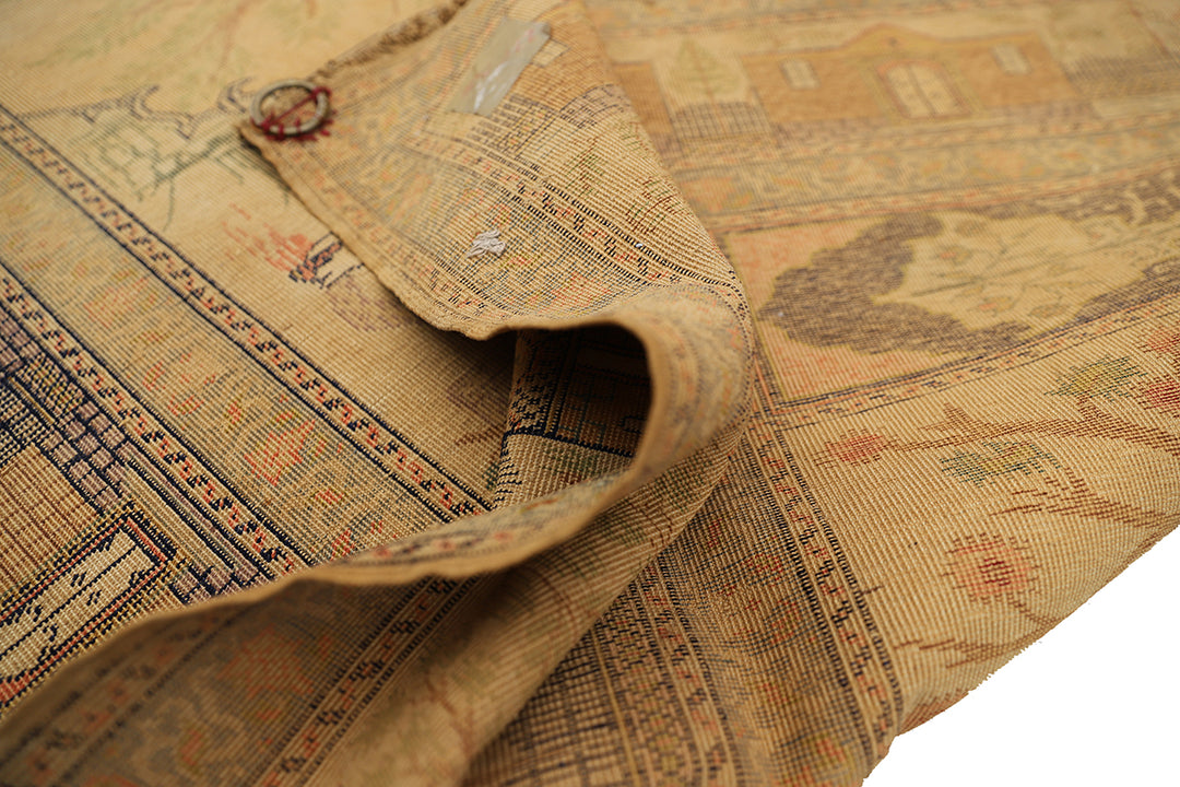 Close-up of a textured fabric with intricate patterns and a button.
