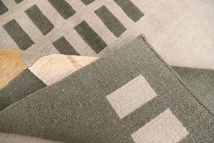 6x9 hand-knotted modern Arts and Crafts wool and silk geometric area rug in green, yellow, ivory, and grey