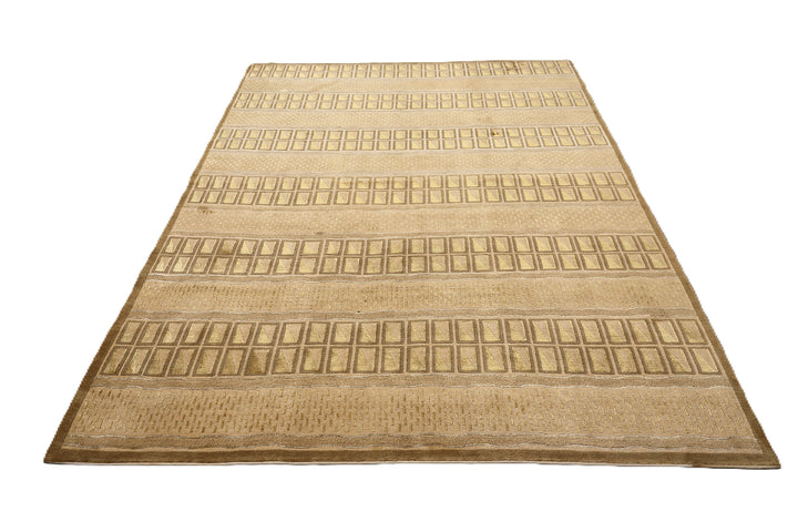 6x9 hand-knotted modern Tibetan wool and silk linear rug in gold and green featuring a plush cut pile with hand-carved geometric lines