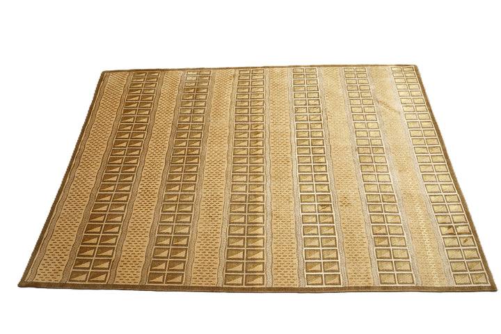 6x9 hand-knotted modern Tibetan wool and silk linear rug in gold and green featuring a plush cut pile with hand-carved geometric lines