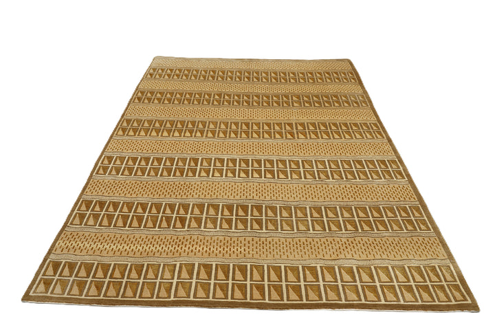 6x9 hand-knotted modern Tibetan wool and silk linear rug in gold and green featuring a plush cut pile with hand-carved geometric lines