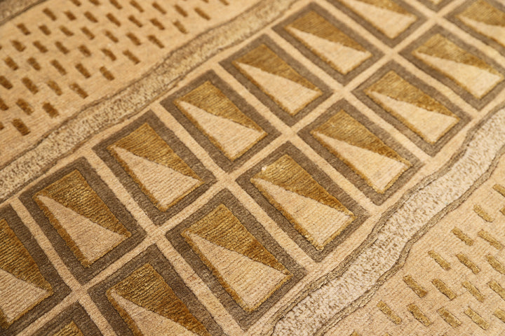 6x9 hand-knotted modern Tibetan wool and silk linear rug in gold and green featuring a plush cut pile with hand-carved geometric lines