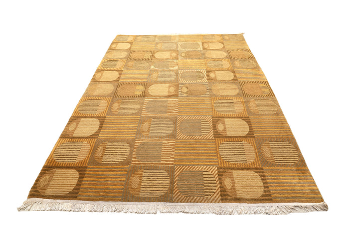 6x9 hand-knotted modern Tibetan wool and silk geometric rug in gold and green featuring a textured cut and loop pile