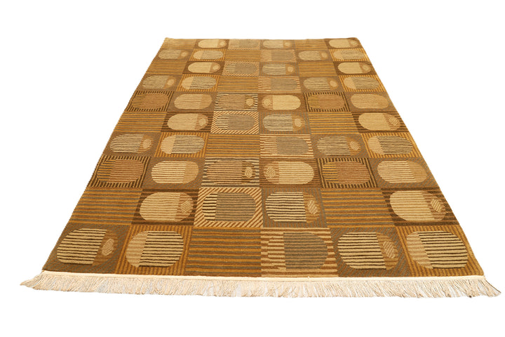 6x9 hand-knotted modern Tibetan wool and silk geometric rug in gold and green featuring a textured cut and loop pile