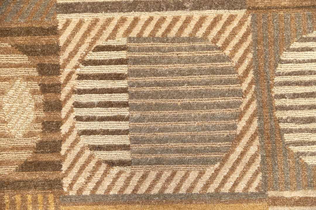 6x9 hand-knotted modern Tibetan wool and silk geometric rug in gold and green featuring a textured cut and loop pile