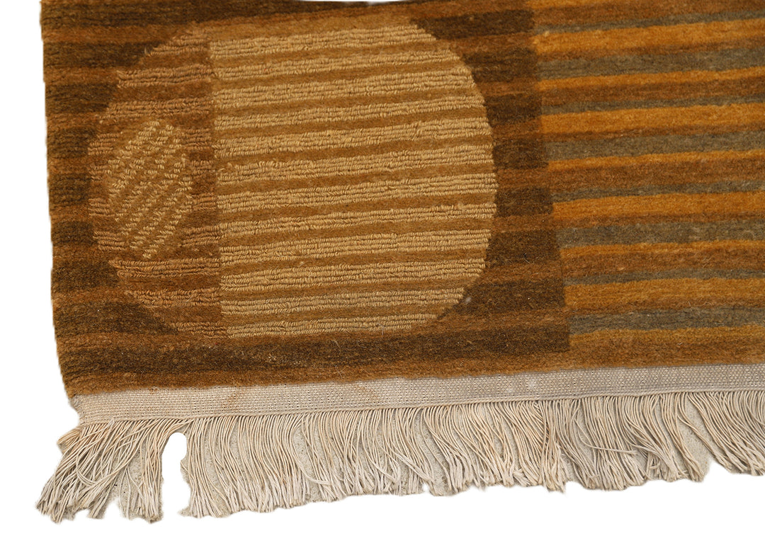 6x9 hand-knotted modern Tibetan wool and silk geometric rug in gold and green featuring a textured cut and loop pile