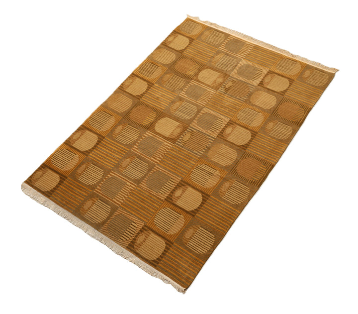 6x9 hand-knotted modern Tibetan wool and silk geometric rug in gold and green featuring a textured cut and loop pile
