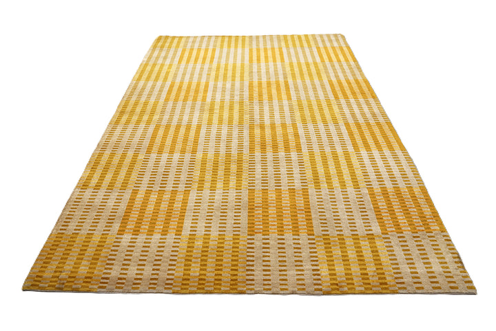 6x9 hand-knotted modern Tibetan wool and silk geometric rug in gold, yellow, orange, and brown with a textured cut and loop pile
