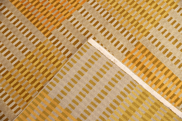 6x9 hand-knotted modern Tibetan wool and silk geometric rug in gold, yellow, orange, and brown with a textured cut and loop pile