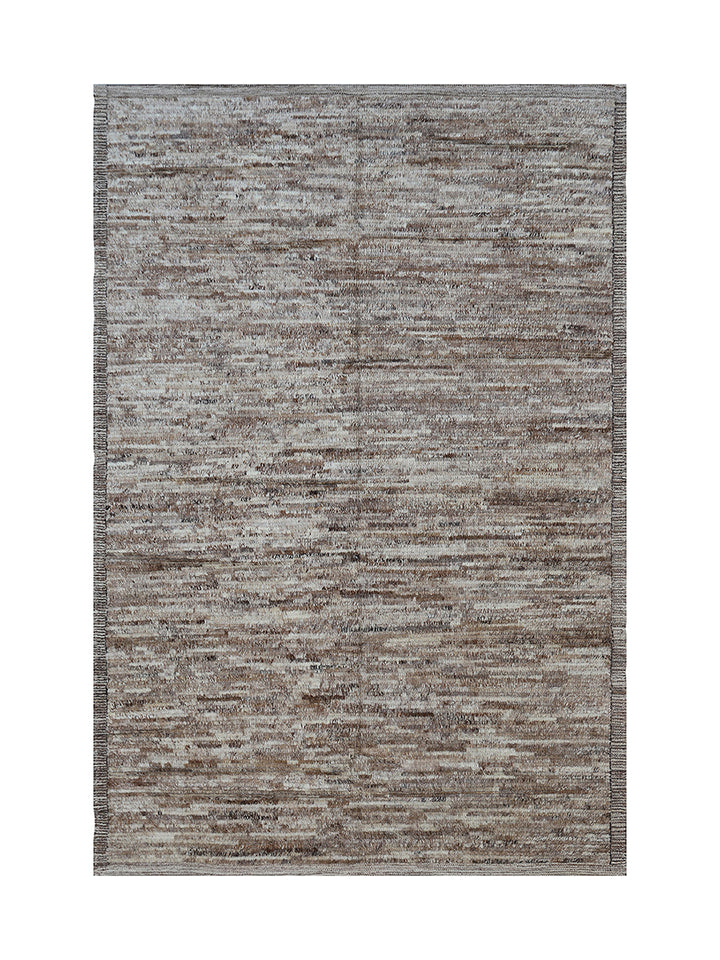Textured area rug with a neutral color palette on a white background