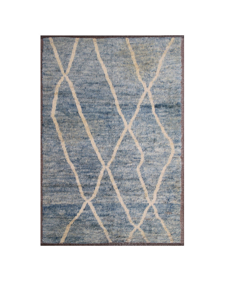 Hand-crafted 9'1" x 6'1" Moroccan-style blue and cream shag wool area rug featuring crisp white stripes and a warm brown border.